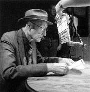 William Burroughs in the process of cut-up